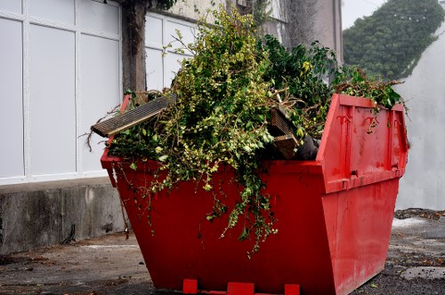 Workers performing builders waste clearance on a construction site in Bayswater